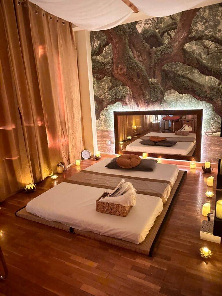 Massage room with tree mural and draped canopy in Marbella